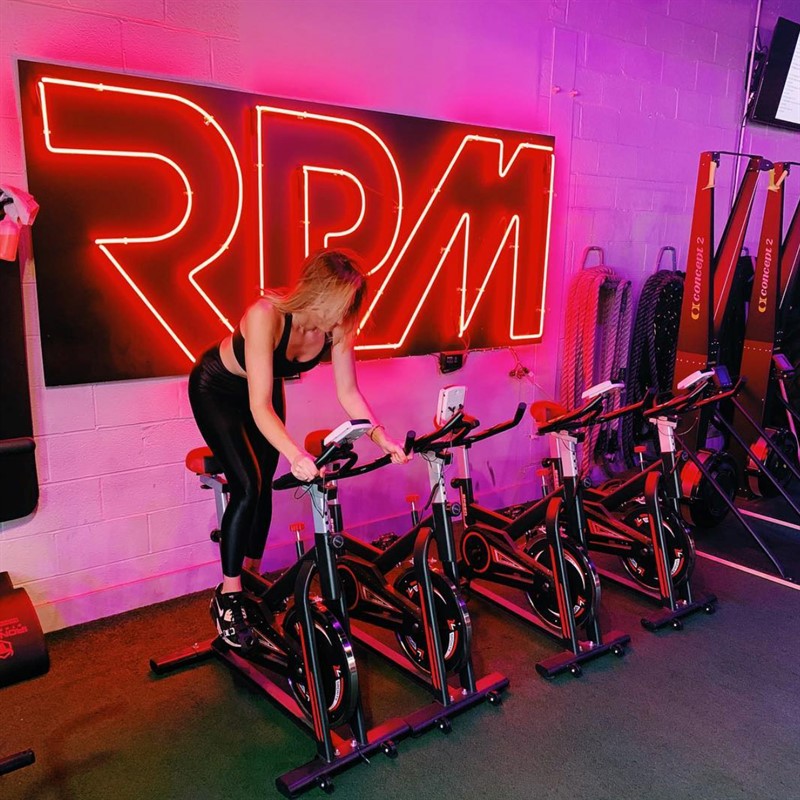 bridjetmorris.com How To Get Out Of The Winter Rut, Featuring RPM Fitness in Birmingham, Michigan RPM logo featured image Bridjet on bike